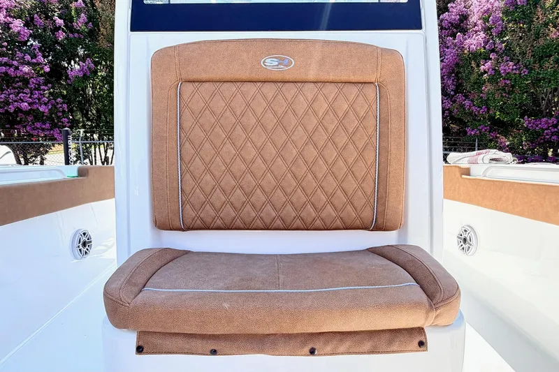Slide: The Image of 2027 Sea Hunt Ultra 275 SE boat seat with diamond-patterned upholstery. - 20