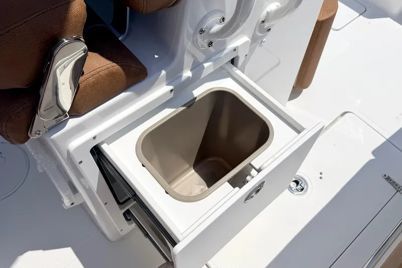 Slide: The Image of Open storage compartment on 2027 Sea Hunt Ultra 275 SE boat. - 10