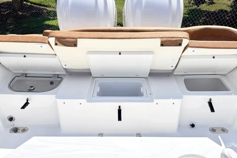 Slide: The Image of 2027 Sea Hunt Ultra 275 SE boat interior with storage compartments and seating. - 16