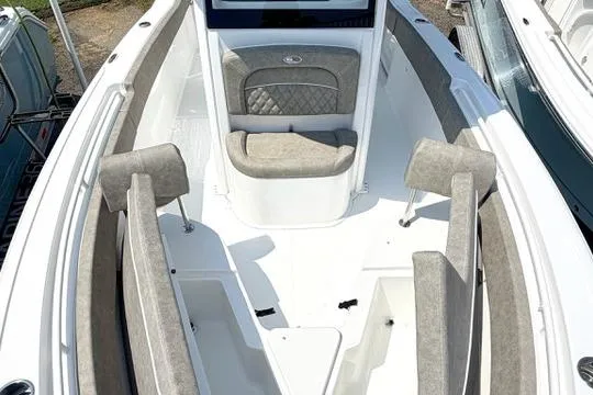 Slide: The Image of 2027 Sea Hunt Ultra 245 SE boat interior with cushioned seating and sleek design. - 32