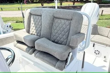 Slide: The Image of 2027 Sea Hunt Ultra 245 SE boat seats with quilted upholstery and armrests. - 14