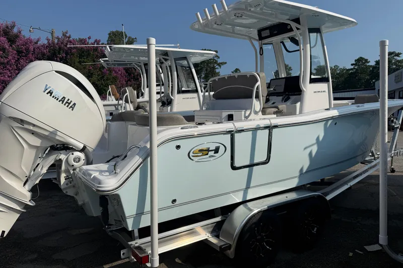 The Image of 2027 Sea Hunt Ultra 245 SE boat with Yamaha engine on trailer. - 0