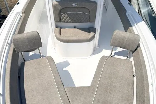 Slide: The Image of 2027 Sea Hunt Ultra 245 SE boat interior with cushioned seating and headrests. - 29