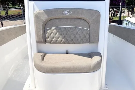Slide: The Image of 2027 Sea Hunt Ultra 245 SE boat seat with quilted design and beige upholstery. - 27