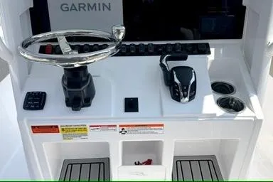 Slide: The Image of 2027 Sea Hunt Ultra 245 SE boat console with Garmin navigation system. - 11