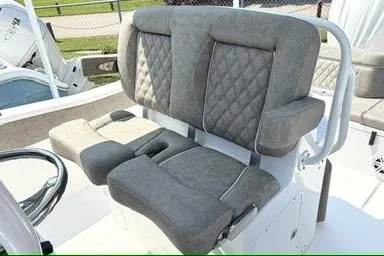 Slide: The Image of 2027 Sea Hunt Ultra 245 SE boat seating with cushioned, diamond-stitched upholstery. - 15