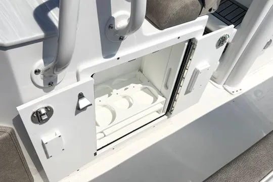 Slide: The Image of Open storage compartment on 2027 Sea Hunt Ultra 245 SE boat deck. - 19