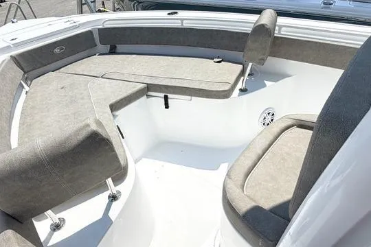 Slide: The Image of Interior seating of 2027 Sea Hunt Ultra 245 SE boat, featuring cushioned benches. - 23