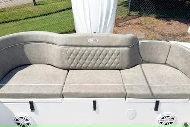 Slide: The Image of 2027 Sea Hunt Ultra 245 SE boat seating with gray upholstery and diamond pattern. - 5