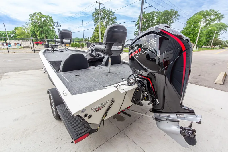 Slide: The Image of 2023 Tracker Pro Team 190 TX boat with Mercury Pro XS engine, parked outdoors. - 4