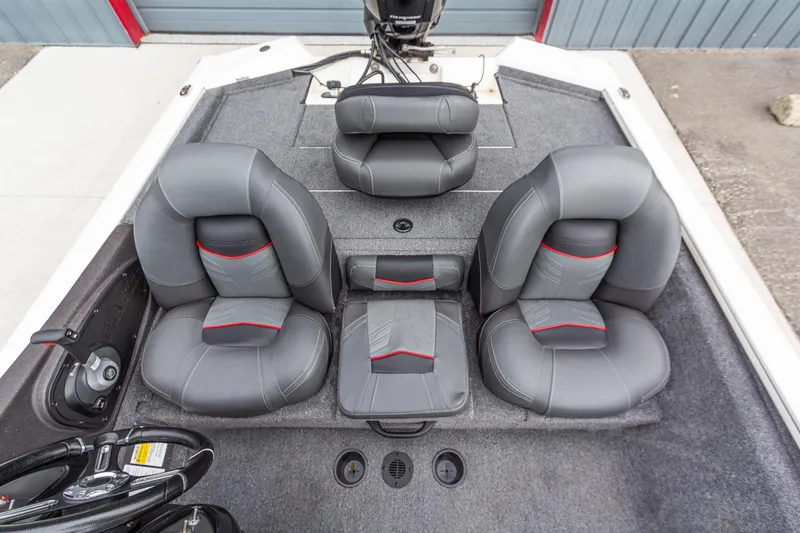 Slide: The Image of 2023 Tracker Pro Team 190 TX boat interior with gray and red cushioned seats. - 16
