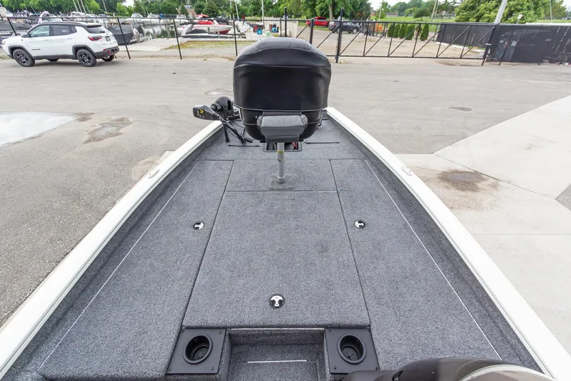 Slide: The Image of 2023 Tracker Pro Team 190 TX boat deck with seating and storage compartments. - 23