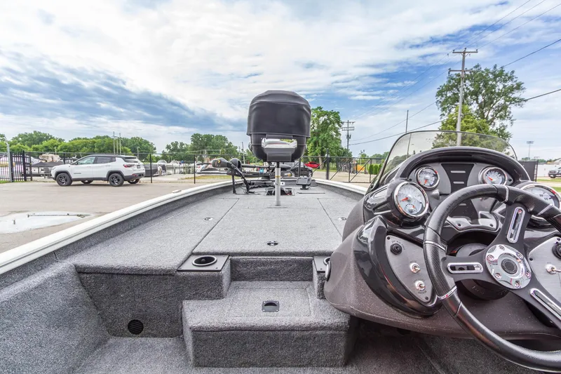 Slide: The Image of 2023 Tracker Pro Team 190 TX boat interior with steering wheel and dashboard gauges. - 21