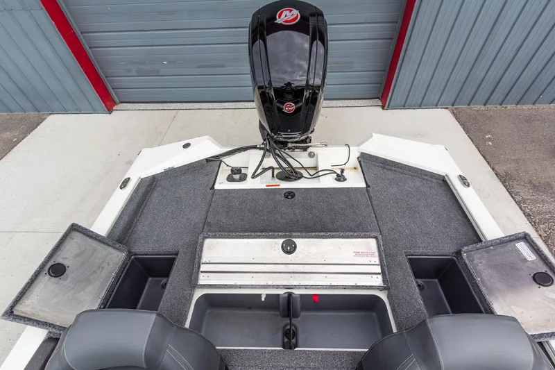 Slide: The Image of 2023 Tracker Pro Team 190 TX boat interior with motor and storage compartments. - 14