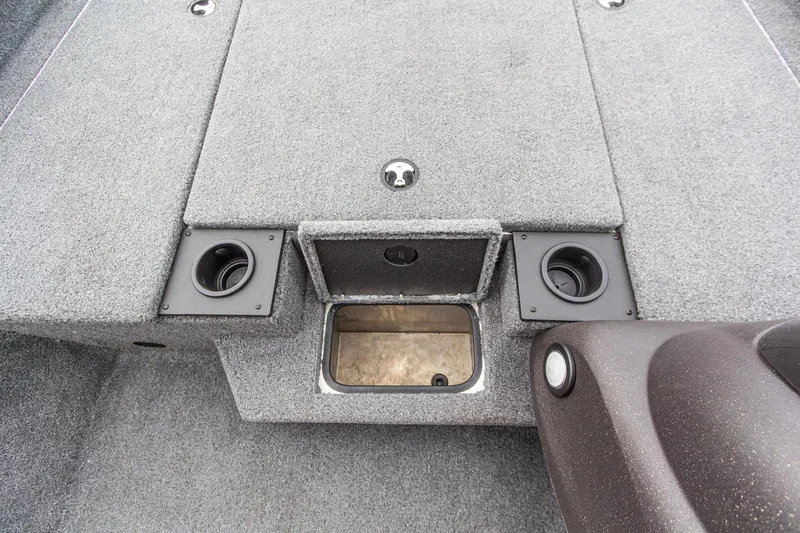 Slide: The Image of 2023 Tracker Pro Team 190 TX boat interior with storage compartment and cup holders. - 22