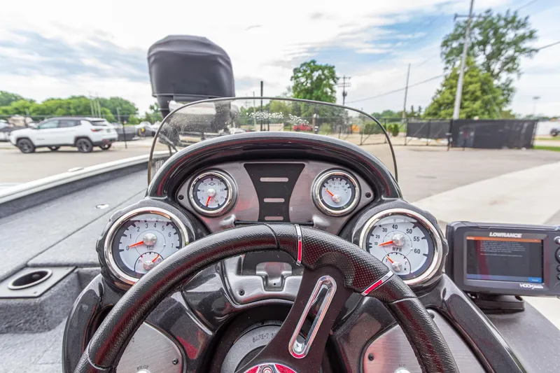 Slide: The Image of Dashboard of 2023 Tracker Pro Team 190 TX boat with gauges and Lowrance display. - 19