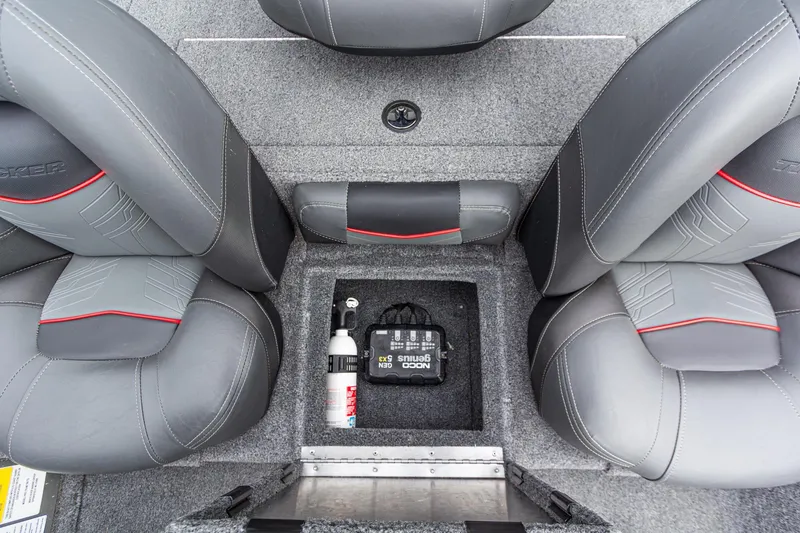 Slide: The Image of 2023 Tracker Pro Team 190 TX boat interior with gray seats and storage compartment. - 17