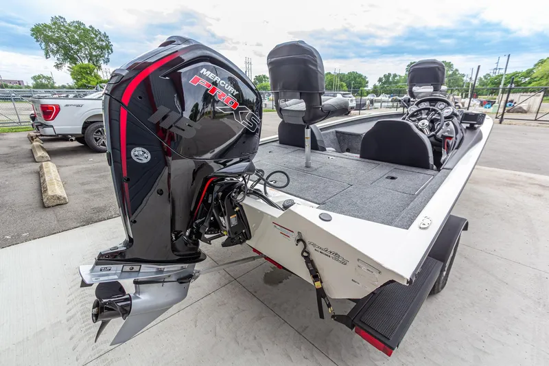 Slide: The Image of 2023 Tracker Pro Team 190 TX boat with Mercury Pro XS engine, parked outdoors. - 6