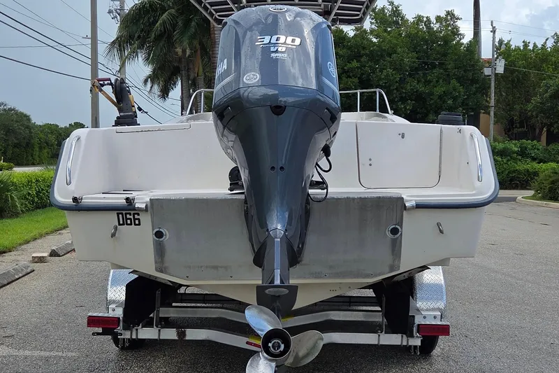 Slide: The Image of 1994 Grady-White Chase 263 boat with Yamaha 300 outboard motor on trailer. - 4