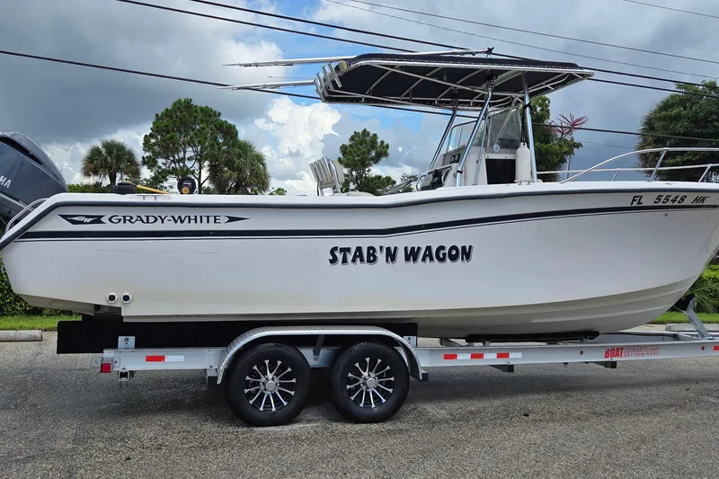 The Image of 1994 Grady-White Chase 263 boat named "Stab'n Wagon" on trailer, side view. - 0