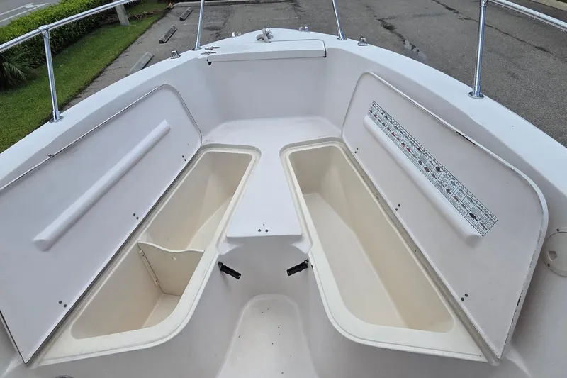 Slide: The Image of Open storage compartments on a 1994 Grady-White Chase 263 boat deck. - 8