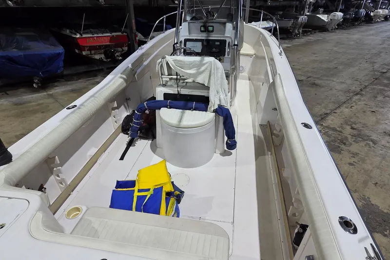 Slide: The Image of 1994 Grady-White Chase 263 boat interior with life jackets and console. - 13