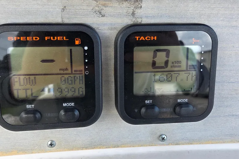 Slide: The Image of Digital gauges on a 1994 Grady-White Chase 263 boat dashboard. - 6