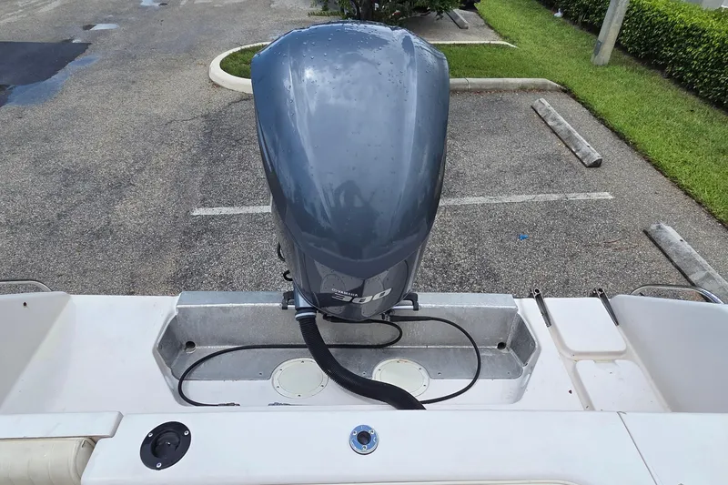 Slide: The Image of 1994 Grady-White Chase 263 boat with Yamaha 300 outboard engine in parking lot. - 12