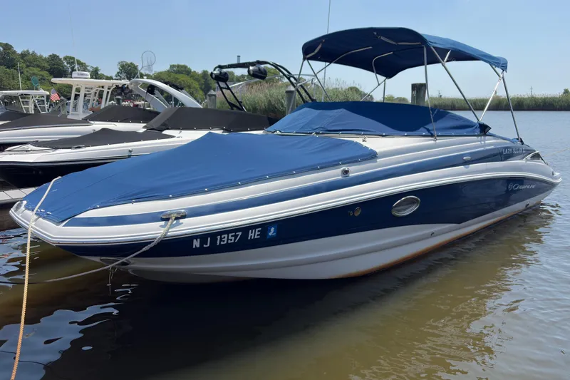 The Image of 2013 Crownline Eclipse E6 boat docked with blue cover and canopy. - 0