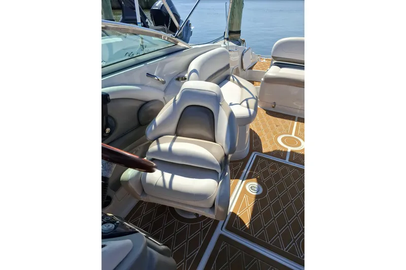 Slide: The Image of 2013 Crownline Eclipse E6 boat interior with luxurious seating and stylish flooring. - 2