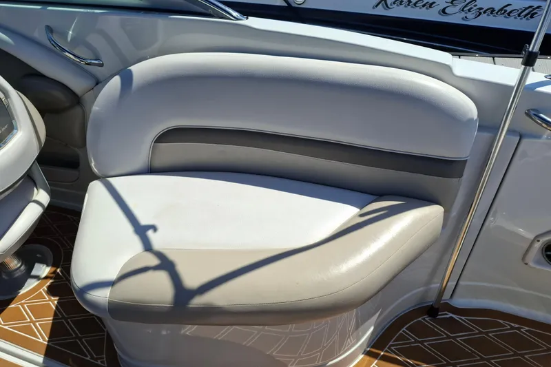 Slide: The Image of 2013 Crownline Eclipse E6 boat interior with cushioned seating and sleek design. - 7