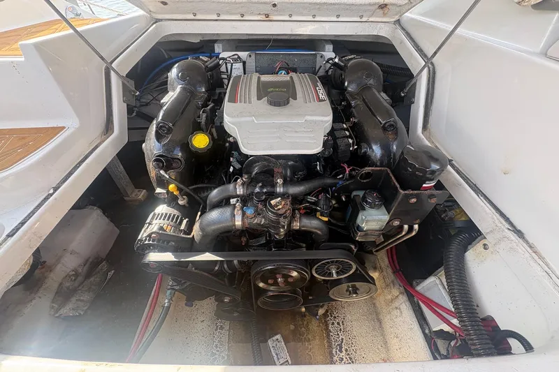 Slide: The Image of Engine compartment of a 2013 Crownline Eclipse E6 boat, showcasing detailed mechanical components. - 9
