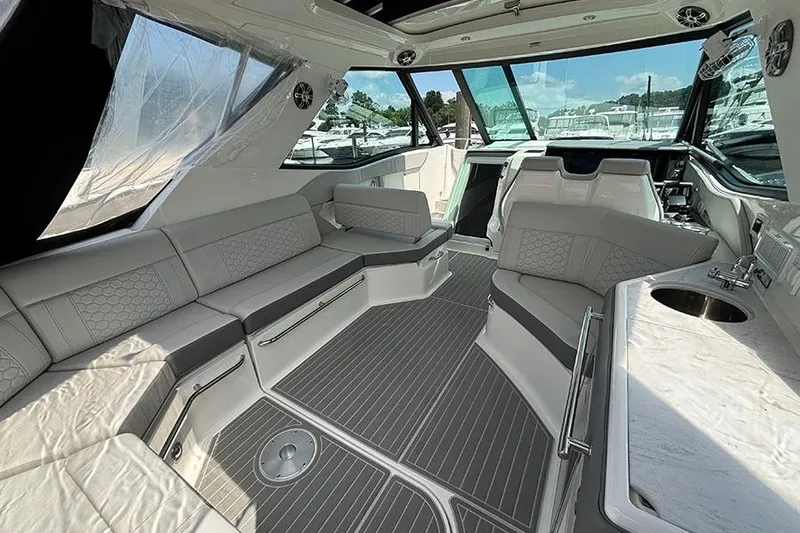 Slide: The Image of Luxurious interior of 2024 Sea Ray Sundancer 320 Outboard with elegant seating and modern amenities. - 19