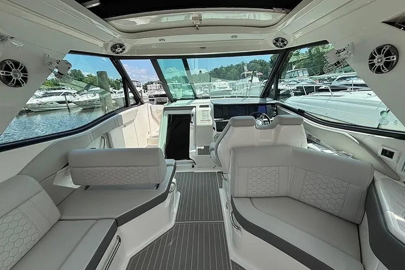 Slide: The Image of 2024 Sea Ray Sundancer 320 Outboard interior with luxurious seating and modern design. - 27