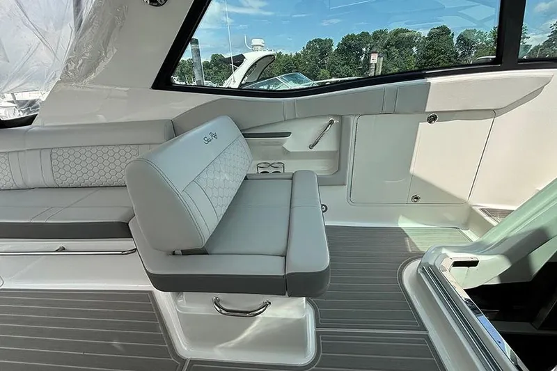 Slide: The Image of 2024 Sea Ray Sundancer 320 Outboard interior with sleek seating and modern design. - 31