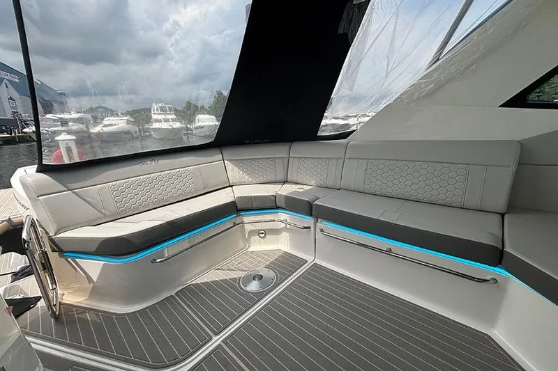 Slide: The Image of Luxurious interior of 2024 Sea Ray Sundancer 320 Outboard with elegant seating and modern design. - 22