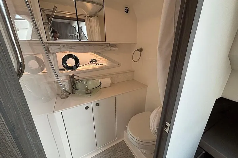 Slide: The Image of 2024 Sea Ray Sundancer 320 Outboard bathroom with modern fixtures and sleek design. - 34