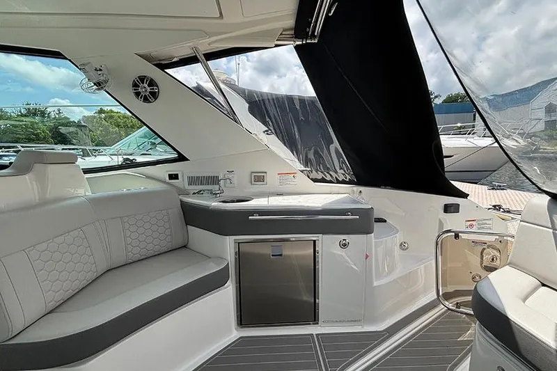 Slide: The Image of Luxurious interior of 2024 Sea Ray Sundancer 320 Outboard with sleek seating and modern amenities. - 24