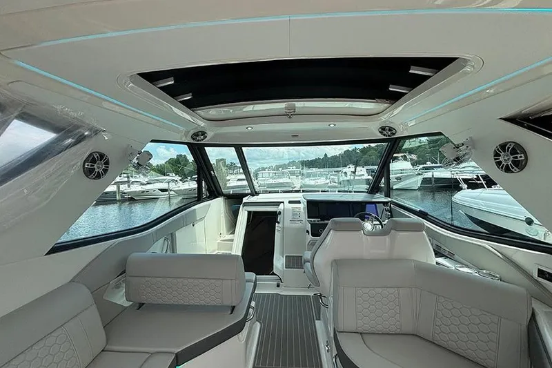 Slide: The Image of 2024 Sea Ray Sundancer 320 Outboard interior with luxurious seating and modern design. - 23