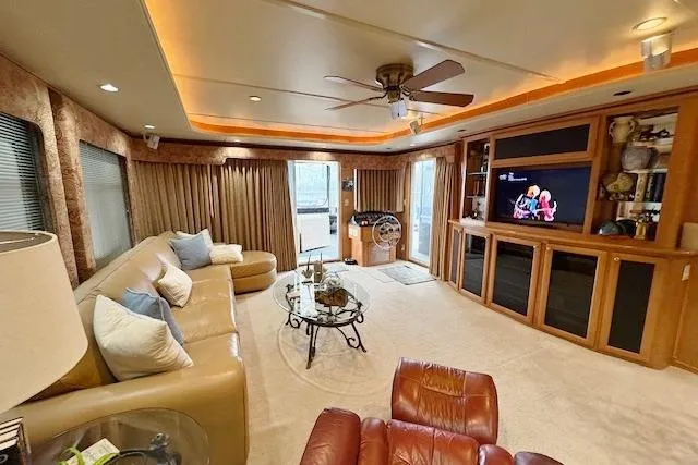 Slide: The Image of Luxurious 2007 Sumerset 18x86 houseboat interior with cozy seating and entertainment area. - 3