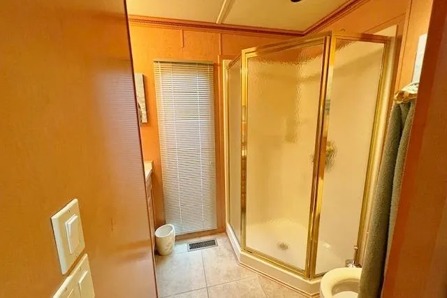 Slide: The Image of Bathroom with glass shower in 2007 Sumerset 18x86 houseboat. - 9