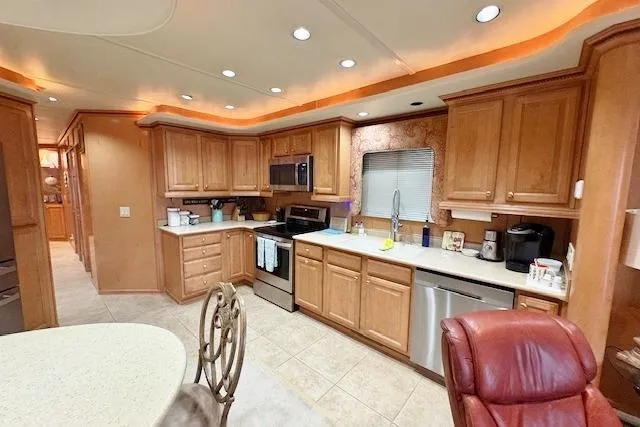 Slide: The Image of Luxurious kitchen interior of 2007 Sumerset 18x86 houseboat with wooden cabinetry and modern appliances. - 4