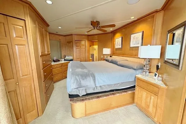 Slide: The Image of Luxurious bedroom in a 2007 Sumerset 18x86 houseboat with wood furnishings and modern decor. - 11