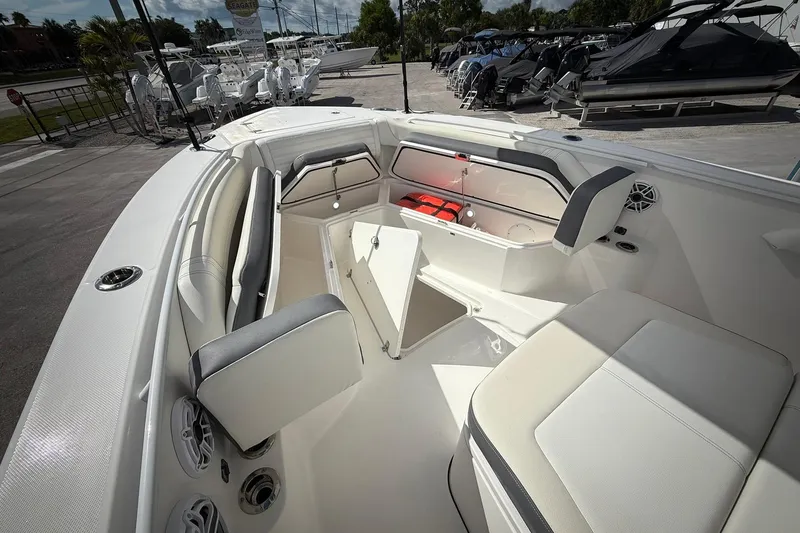 Slide: The Image of 2022 Edgewater 340CC boat interior with seating and storage compartments. - 42