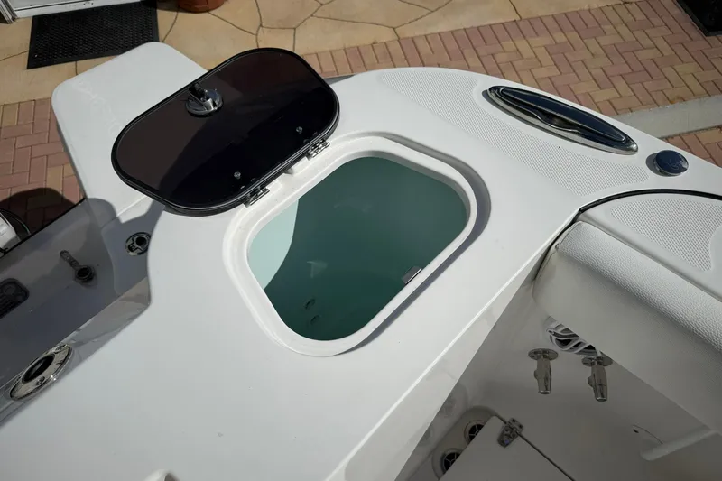 Slide: The Image of Open storage compartment on 2022 Edgewater 340CC boat, showcasing sleek design and functionality. - 17
