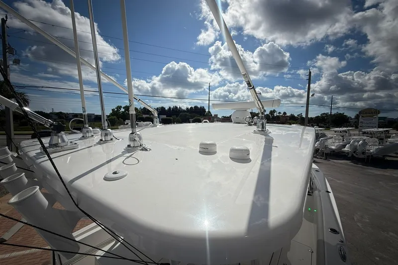 Slide: The Image of 2022 Edgewater 340CC boat deck under a partly cloudy sky. - 52