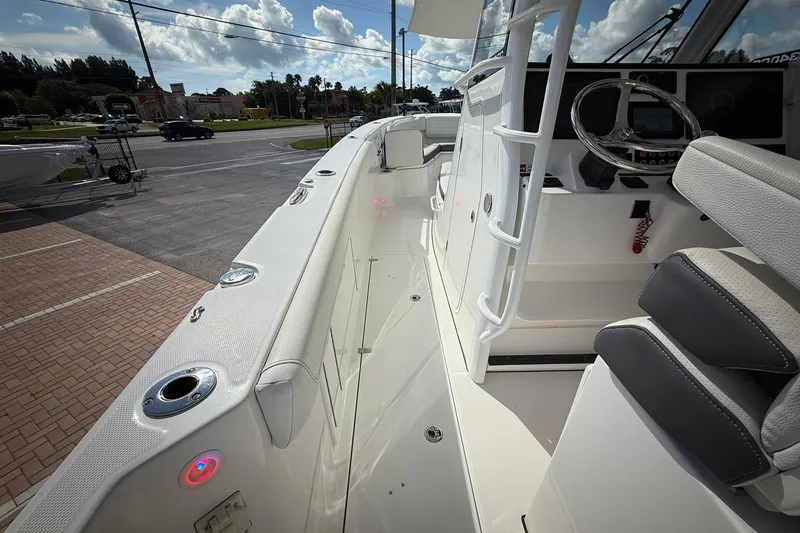 Slide: The Image of 2022 Edgewater 340CC boat interior with modern helm and seating. - 35