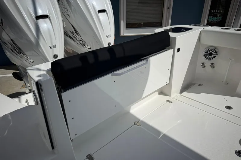Slide: The Image of 2022 Edgewater 340CC boat interior with dual V8 engines and seating area. - 16