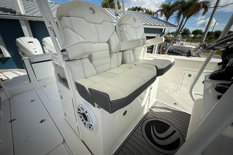Slide: The Image of 2022 Edgewater 340CC boat interior with plush seating and modern design. - 31