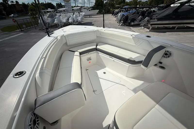 Slide: The Image of Luxurious seating area on a 2022 Edgewater 340CC boat, showcasing modern design and comfort. - 41